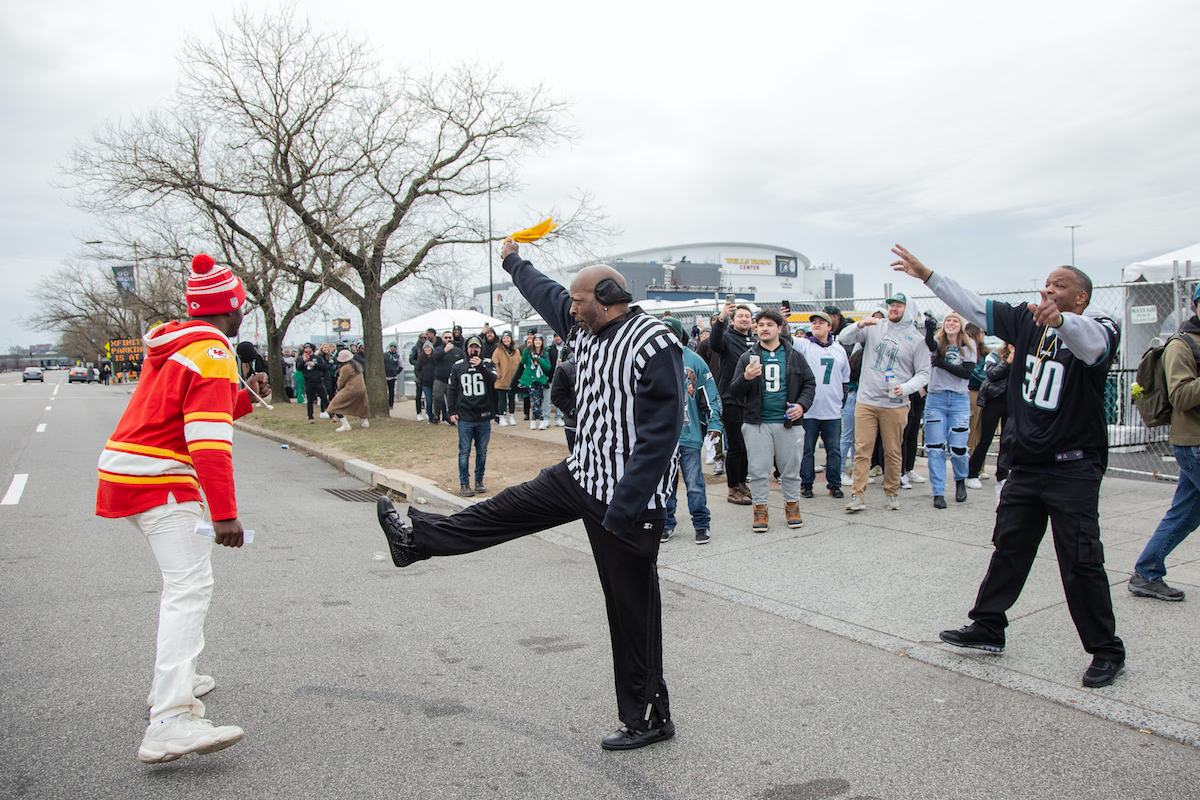 Ace Calloway ''ejects'' a rouge Cheifs fan from the line outside of Xfinity Live