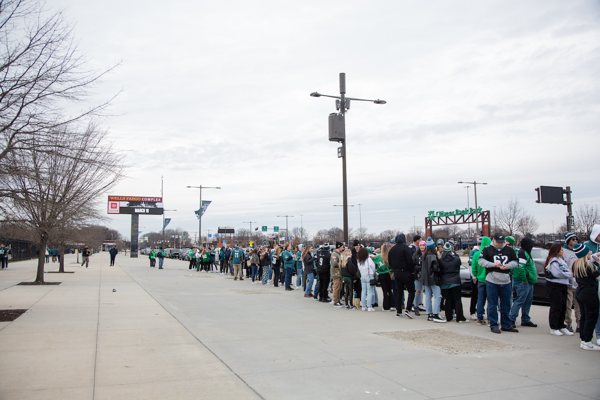 Fans line up outside of Xfinity Live! to watch the Philadelphia Eagles play the Kanas City Chiefs in Super Bowl LVII. (Emily Cohen for WHYY)