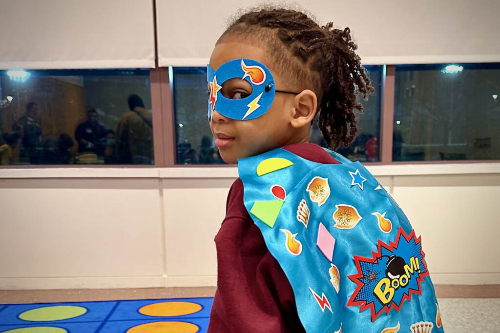 2023 02 24-provided-philadelphia national liberty museum-beyond wakanda event child A girl poses with a superhero cape and mask.