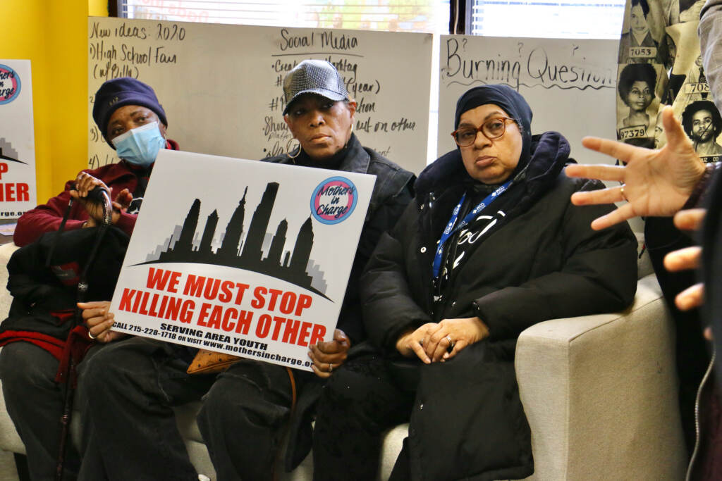 2023 02 27-e lee-philadelphia north broad and susquehanna-anti gun violence meeting and march mothers in charge A group of activists pose for a photo.
