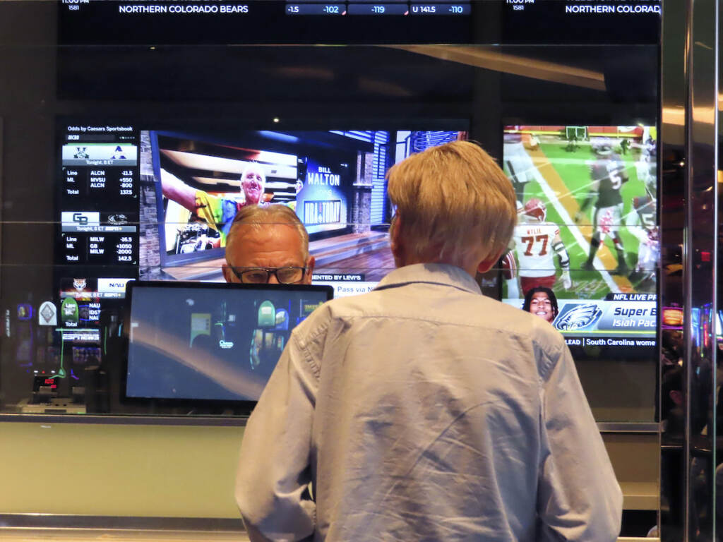 Super Bowl Betting Football A customer (right) makes a sports bet at the Ocean Casino Resort in Atlantic City, N.J., Monday, Feb. 6, 2023