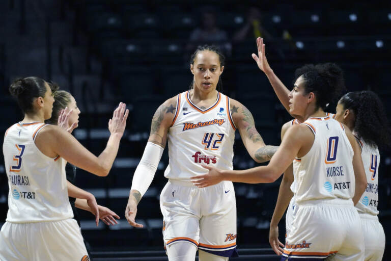 File photo: Phoenix Mercury's Brittney Griner (42) is congratulated on a play against the Seattle Storm in the first half of the second round of the WNBA basketball playoffs Sunday, Sept. 26, 2021, in Everett, Wash. (AP Photo/Elaine Thompson, File)