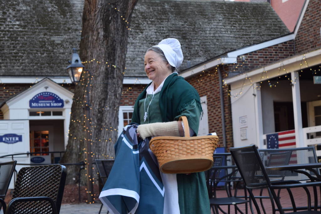 DSC_0078 Betsy Ross impersonator Carol Spacht waiting to greet the Eagles fans before putting up the Eagles flag. (Ella Lathan/WHYY)