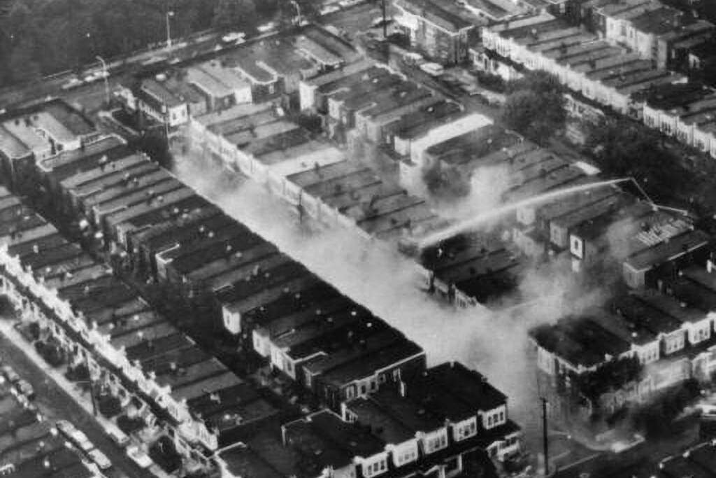 aerial-move-bombing An aerial photo of the damaged rowhomes after the MOVE bombing