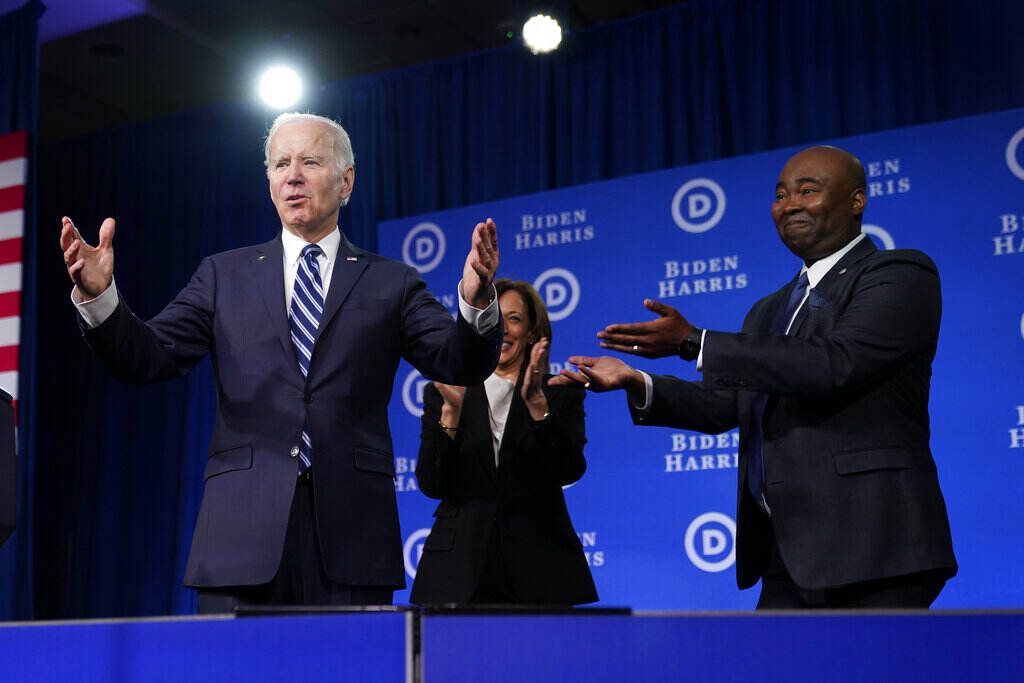 Joe Biden Biden stands onstage.
