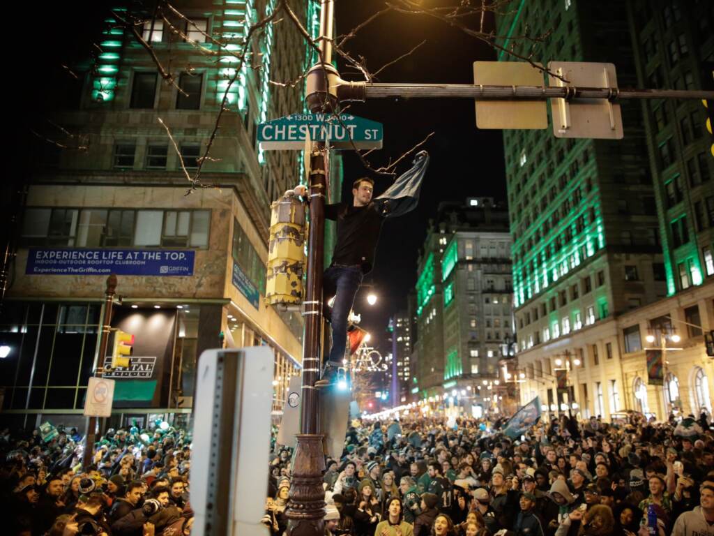 The last time the Philadelphia Eagles won the Super Bowl was in 2018, defeating the New England Patriots. A man climbs a traffic pole as Philadelphia Eagles fans celebrate victory in Super Bowl LII against the New England Patriots on February 4, 2018 in Philadelphia