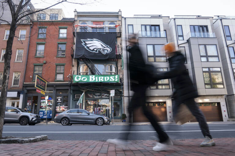 An Eagles banner hangs on a building in Philadelphia
