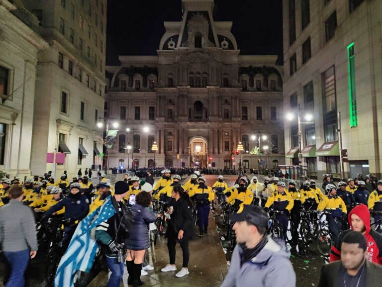 A police line sweeps down South Broad from City Hall. (Peter Crimmins/WHYY)