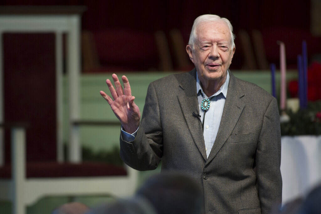 Jimmy Carter Hospice Care Jimmy Carter waves.