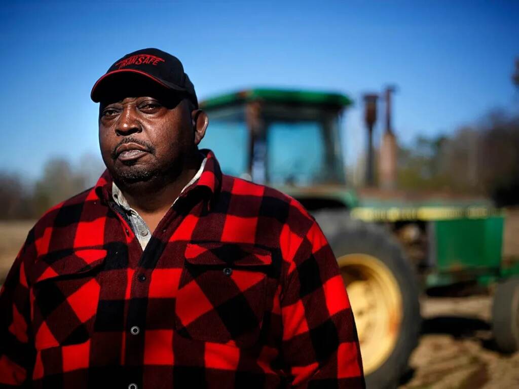 lucious-abrams-716d479dfe1d86c6ff9100212c3e149db5c1179d-s1600-c85 Lucious Abrams, a plaintiff in the Pigford v. Glickman class action lawsuit, stands in front of a tractor on his Georgia farm