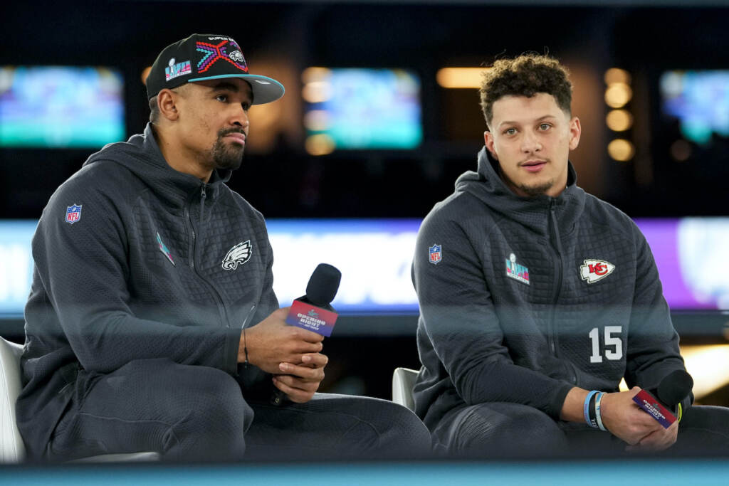Super Bowl Football Jalen Hurts and Patrick Mahomes sitting together for a press event ahead of the Super Bowl