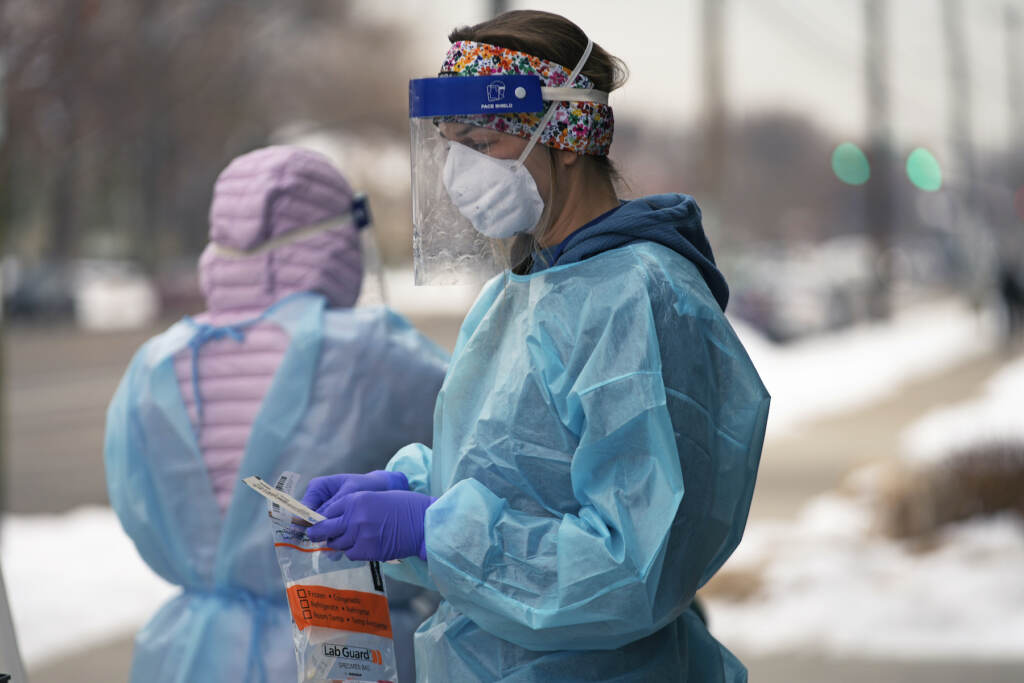 Virus Outbreak Biden Explainer A nurse prepares for a COVID-19 test outside the Salt Lake County Health Department, Dec. 20, 2022, in Salt Lake City. The declaration of a COVID-19 public health emergency three years ago changed the lives of millions of Americans by offering increased health care coverage, beefed up food assistance and universal access to coronavirus vaccines and tests. Much of that is now coming to an end, with President Joe Biden's administration saying it plans to end the emergencies declared around the pandemic on May 11, 2023. (AP Photo/Rick Bowmer, File)