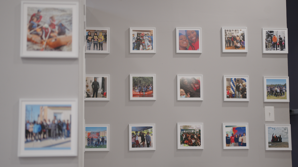 A photo wall of YEAH Philly’s staff and teen trips