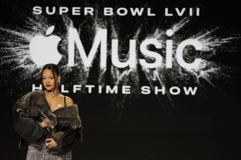 Rihanna poses for a photo after a halftime show news conference