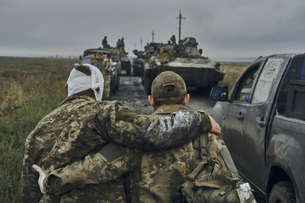 Russia Ukraine War What Lies Ahead A Ukrainian soldier helps a wounded comrade on the road in reclaimed territory in the Kharkiv region