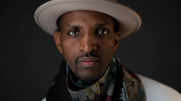 A close-up of J. Ivy's face.