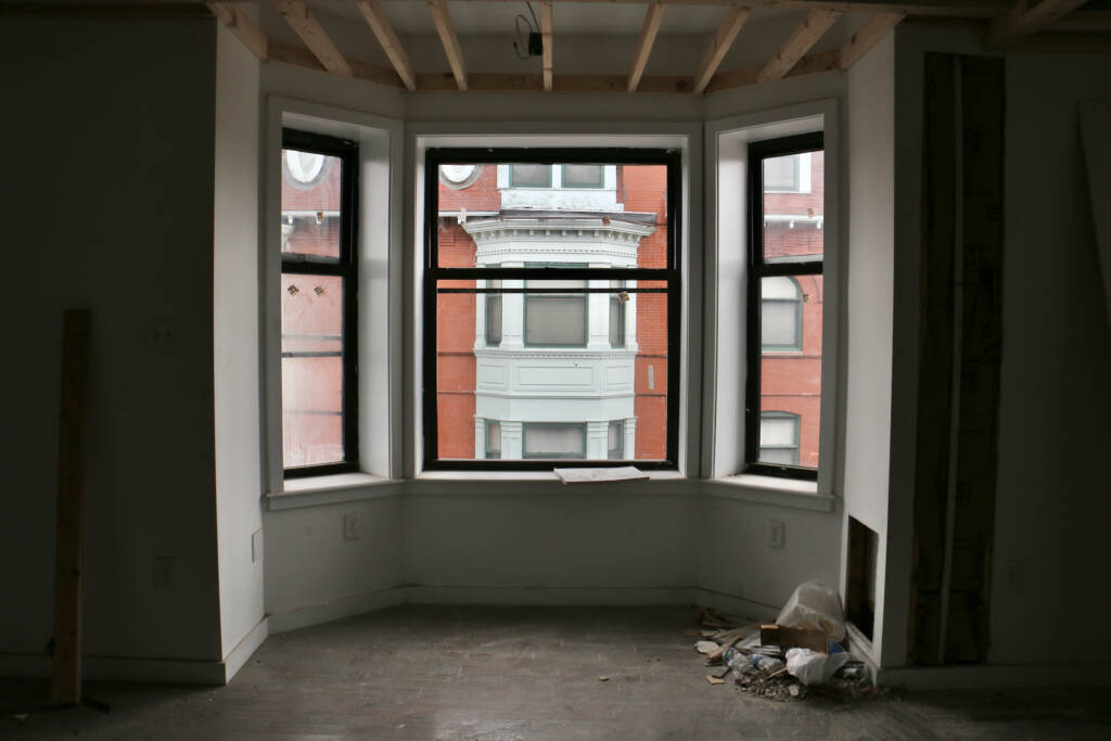 The four-story Victorian building built in 1895 has been converted into 17 apartments with high ceilings and large windows