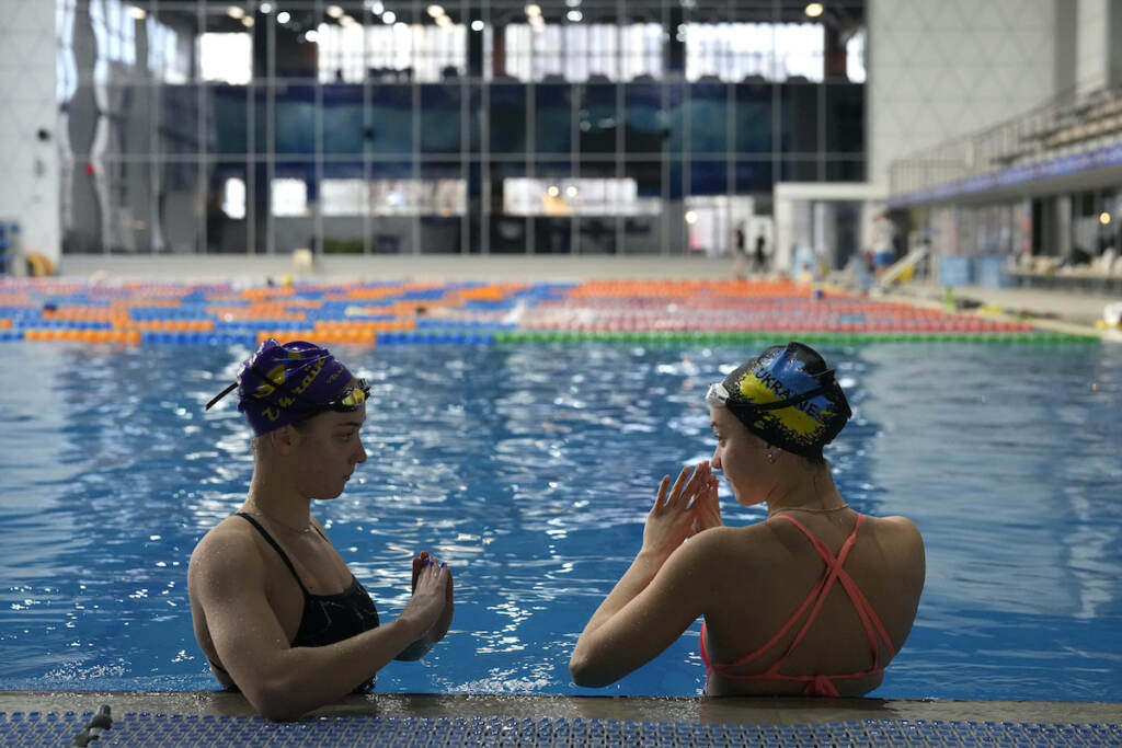 Russia Ukraine War Path to Paris Ukrainian sisters Maryna (left) and Vladyslava Aleksiiva speak during a practice session, in Kyiv