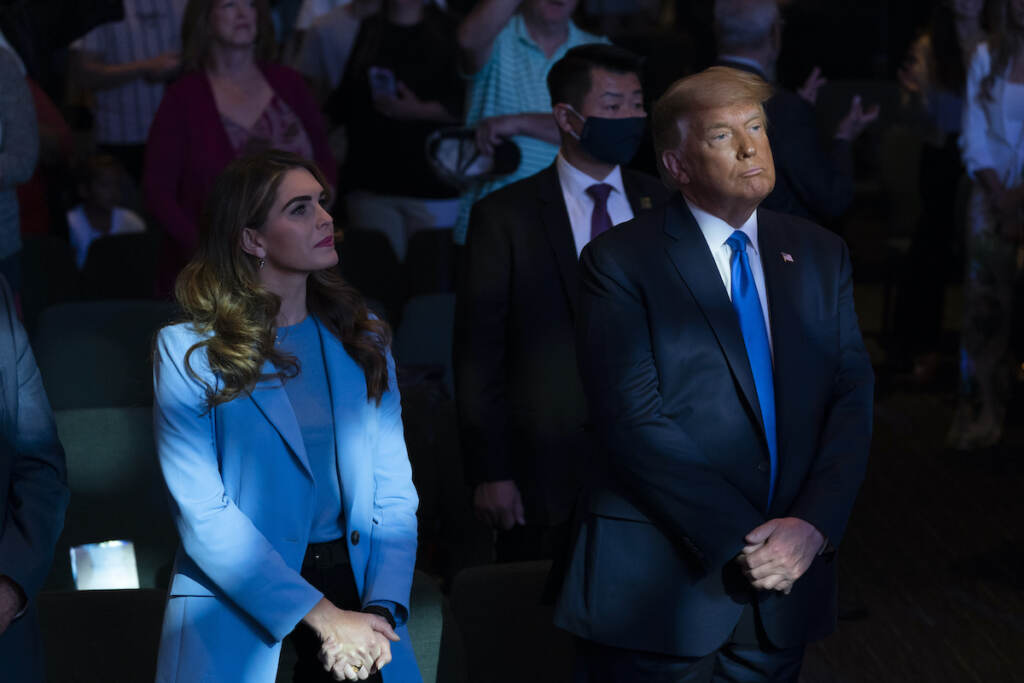President Donald Trump attends church at International Church of Las Vegas with counselor Hope Hicks, left, Sunday, Oct. 18, 2020, in Las Vegas