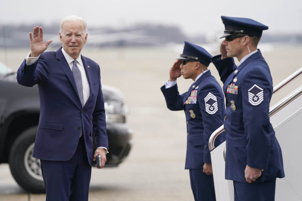 Joe Biden President Joe Biden waves before boarding Air Force One