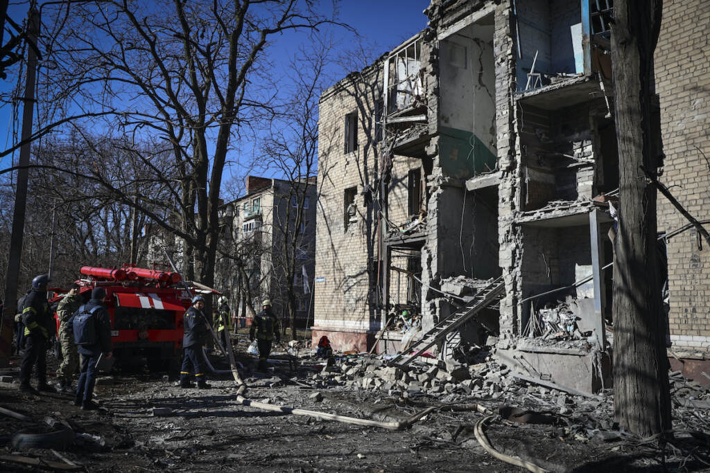 Ukrainian Emergency Service rescuers work on a building damaged by shelling in Kramatorsk, Donetsk region, Ukraine