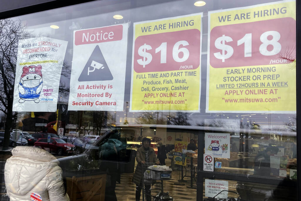 Financial Wellness Pay Transparency File photo: Hiring signs are displayed at a grocery store in Arlington Heights, Ill., Jan. 13, 2023. Employers are increasingly posting salary ranges for job openings, even in states where it's not mandated by law, according to analysts with employment sites Indeed, GlassDoor, and Monster. (AP Photo/Nam Y. Huh, File)
