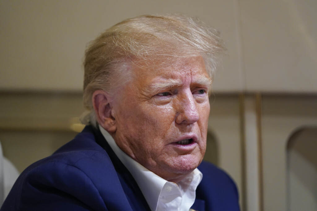 Donald Trump Former President Donald Trump speaks with reporters while in flight on his plane after a campaign rally at Waco Regional Airport, in Waco, Texas, Saturday, March 25, 2023, while en route to West Palm Beach