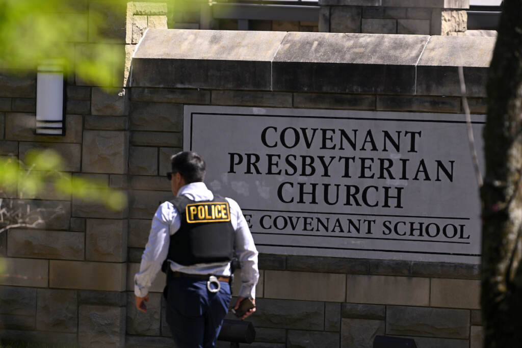 Nashville School Shooting A police officer walks by an entrance to The Covenant School after a shooting in Nashville, Tenn. on Monday, March 27, 2023