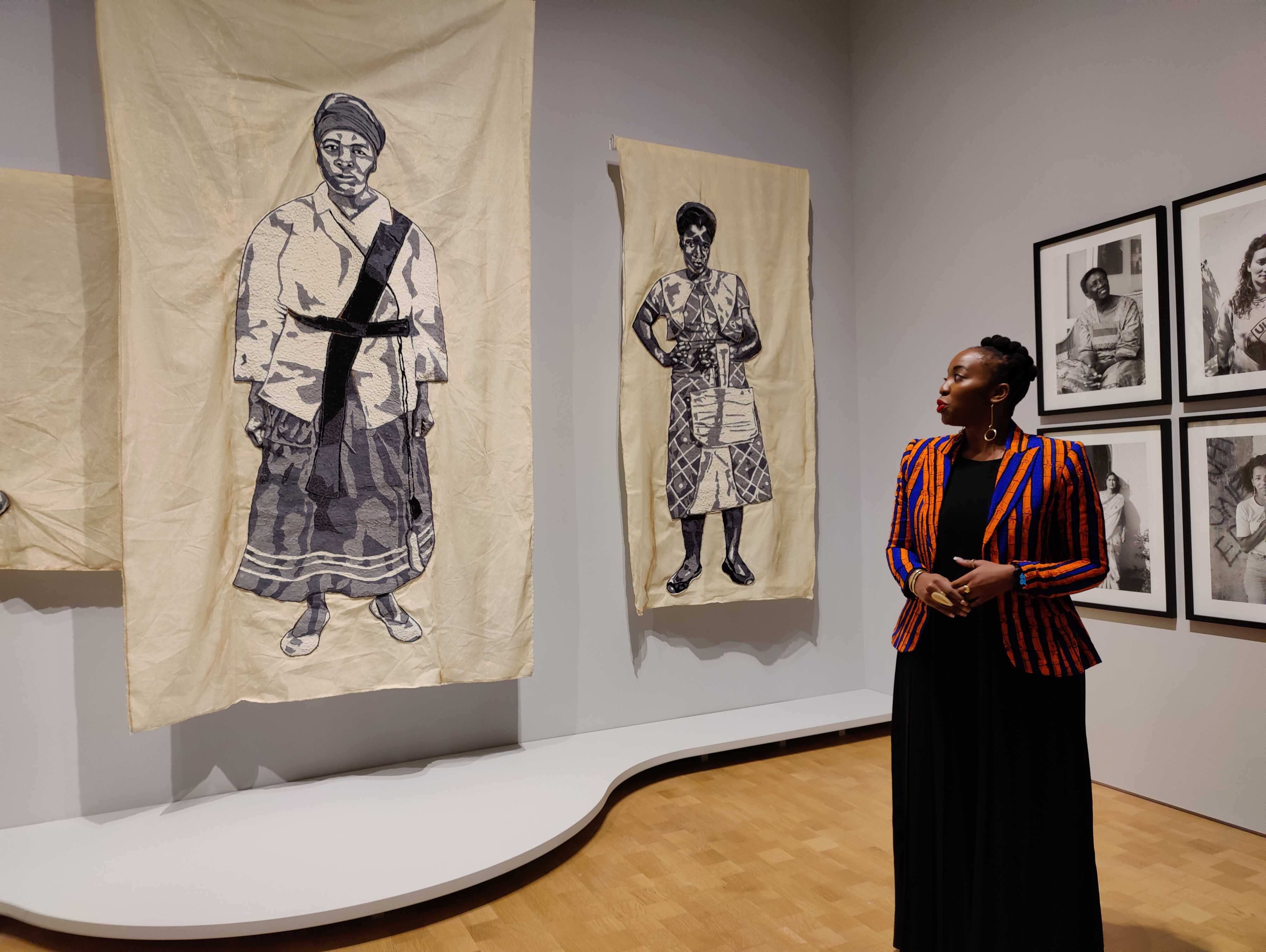 Lebohang Kganye looks at her patchwork cloth re-creation of a black and white photo of her great-grandmother