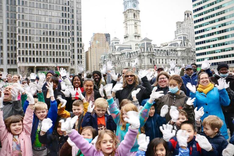 A sea of white gloves fill Love Park as Philadelphians try to break the world record for most people doing jazz hands at once