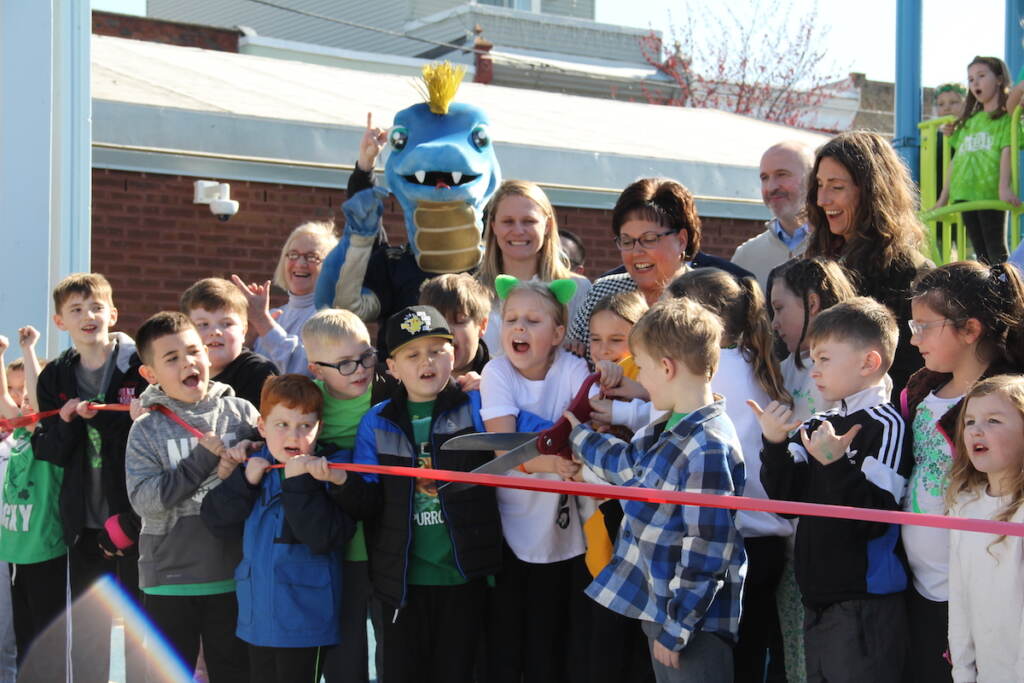 IMG_5553 Kids got to cut the ribbon to celebrate Glavin Playground's reopening on March 16, 2023. (Cory Sharber/WHYY)