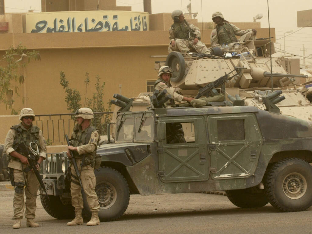 U.S. soldiers stand guard in Fallujah, May 2003. Congress will vote on whether to repeal the authorization for the use of military force orders passed in 1991 and in 2002 for two separate armed conflicts in Iraq. U.S. soldiers stand guard in Fallujah, May 2003. Congress will vote on whether to repeal the authorization for the use of military force orders passed in 1991 and in 2002 for two separate armed conflicts in Iraq. (Murad Sezer/Associated Press)