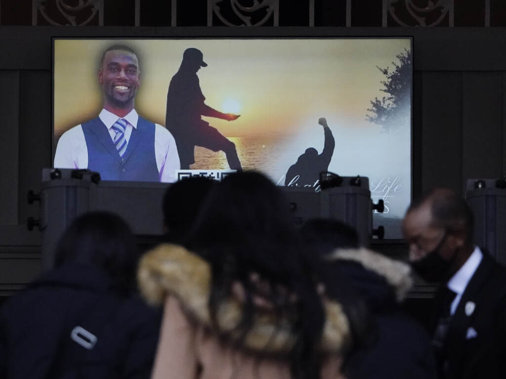 Mourners arrive to the funeral service for Tyre Nichols, at Mississippi Boulevard Christian Church on Wednesday, Feb. 1, 2023, in Memphis, Tenn. The City of Memphis announced the investigation into Nichols’ death has been concluded, announcing an additional 20 hours of video footage will be released Wednesday. Mourners are seen in front of a screen displaying a photo of Tyre Nichols.