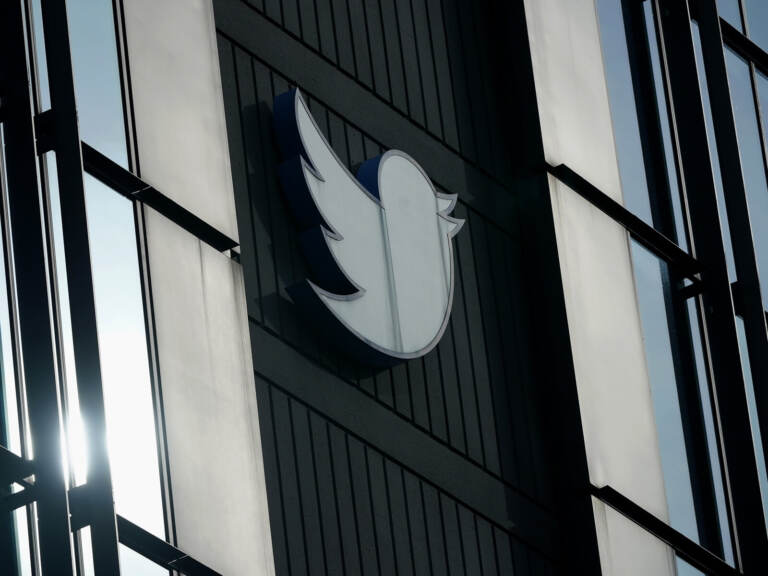 A Twitter logo hangs outside the company's offices in San Francisco