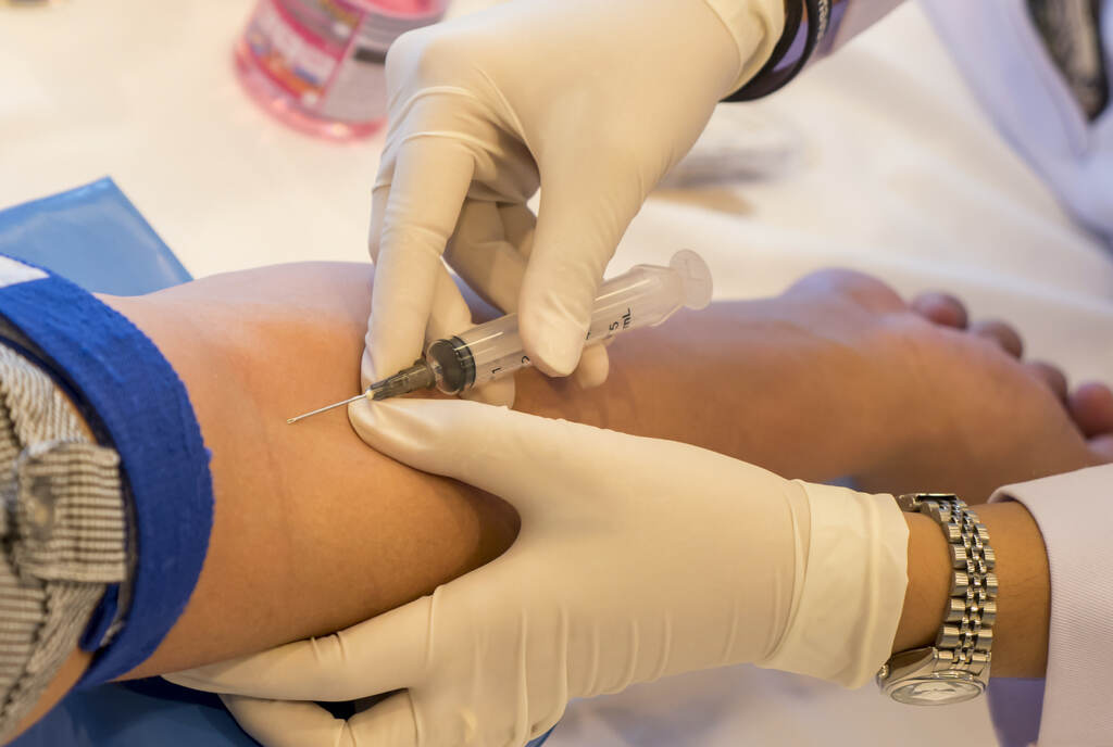 blood-work-doctor-bigstock A patient is getting blood drawn