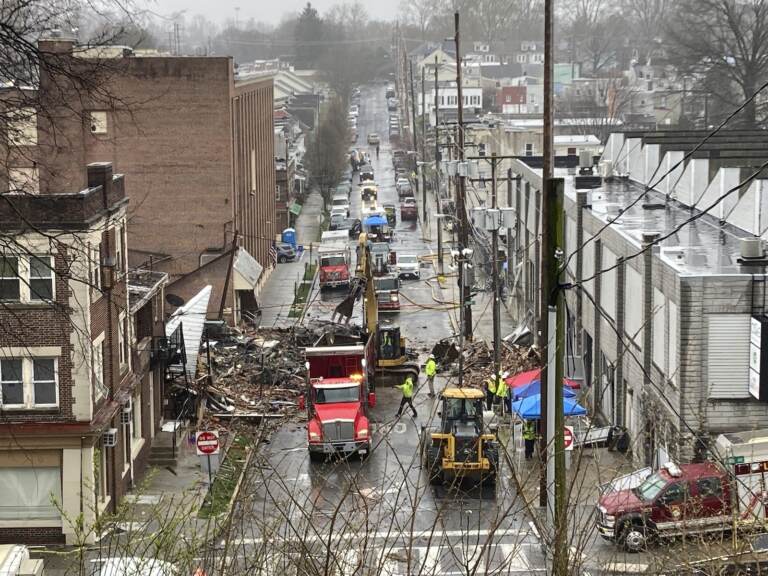Emergency responders and heavy equipment are seen at the site of a deadly explosion at a chocolate factory in West Reading, Pennsylvania.
