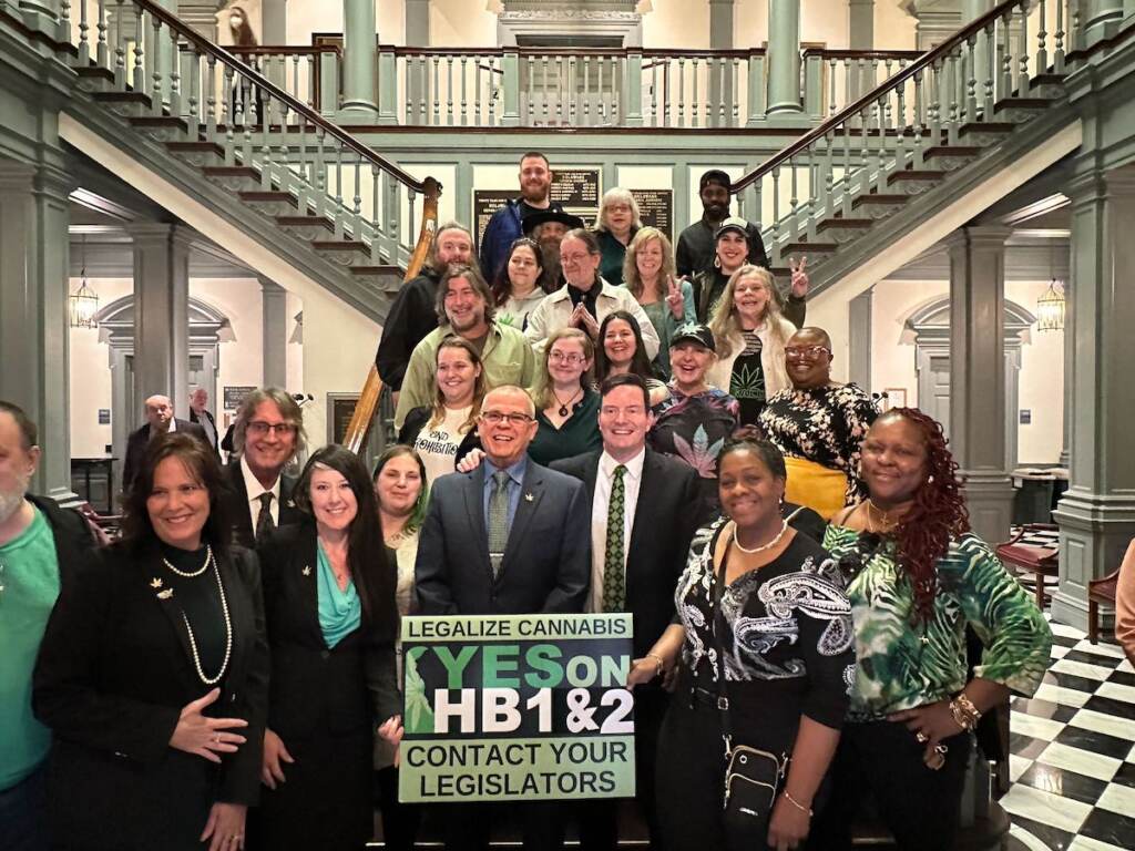 delaware-legalize-marijuana-bills A group of people supporting legalization of marijuana are gathered in the Delaware State Capitol.