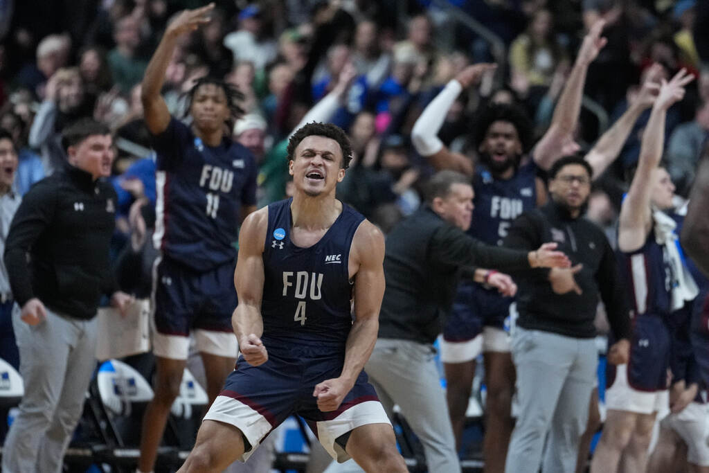 NCAA Fairleigh Dickinson Purdue Basketball A player celebrates on the basketball court.