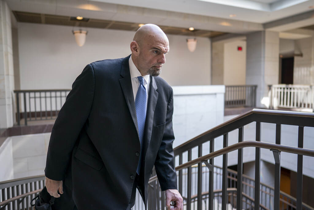 John Fetterman Fetterman walks in the Capitol.
