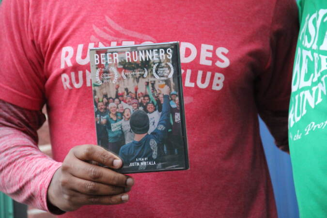 A close-up of someone holding up a DVD case with the title 