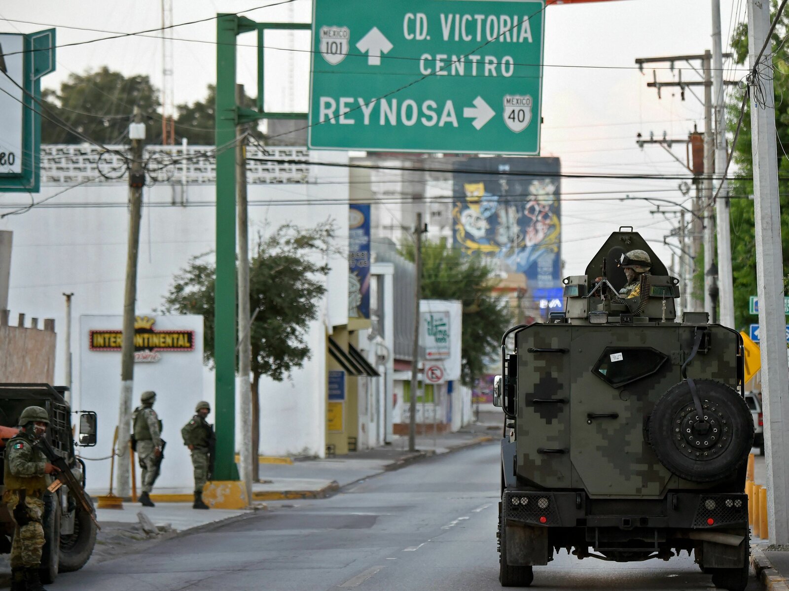 MEXICO-MISSING-RELATIVES Members of the National Guard wait for members of the General Attorney¨s Office to leave in a caravan with relatives of disappeared persons to a property called