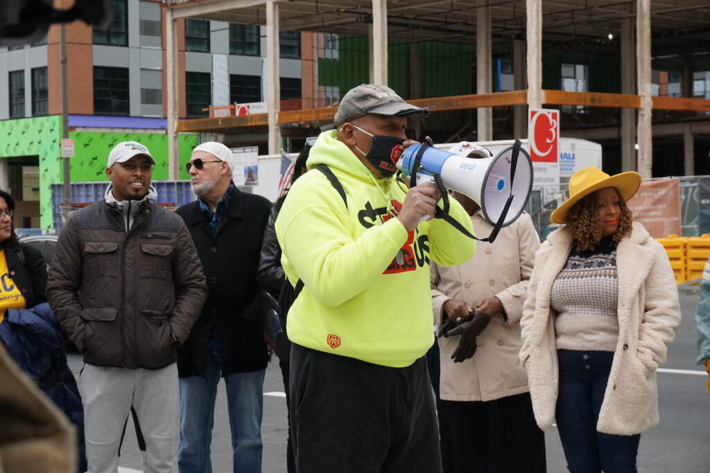 jamal-johnson-8 Jamal Johnson speaks into a megaphone.