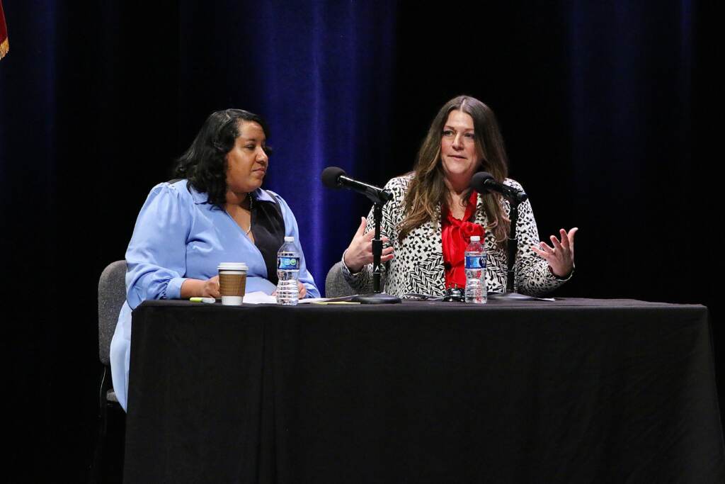 Tya Winn and Rebecca Johnson sitting at a table