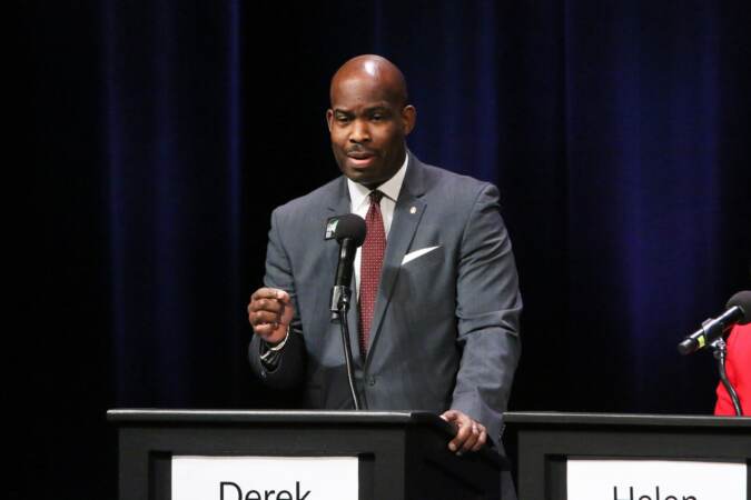 Derek Green at a podium