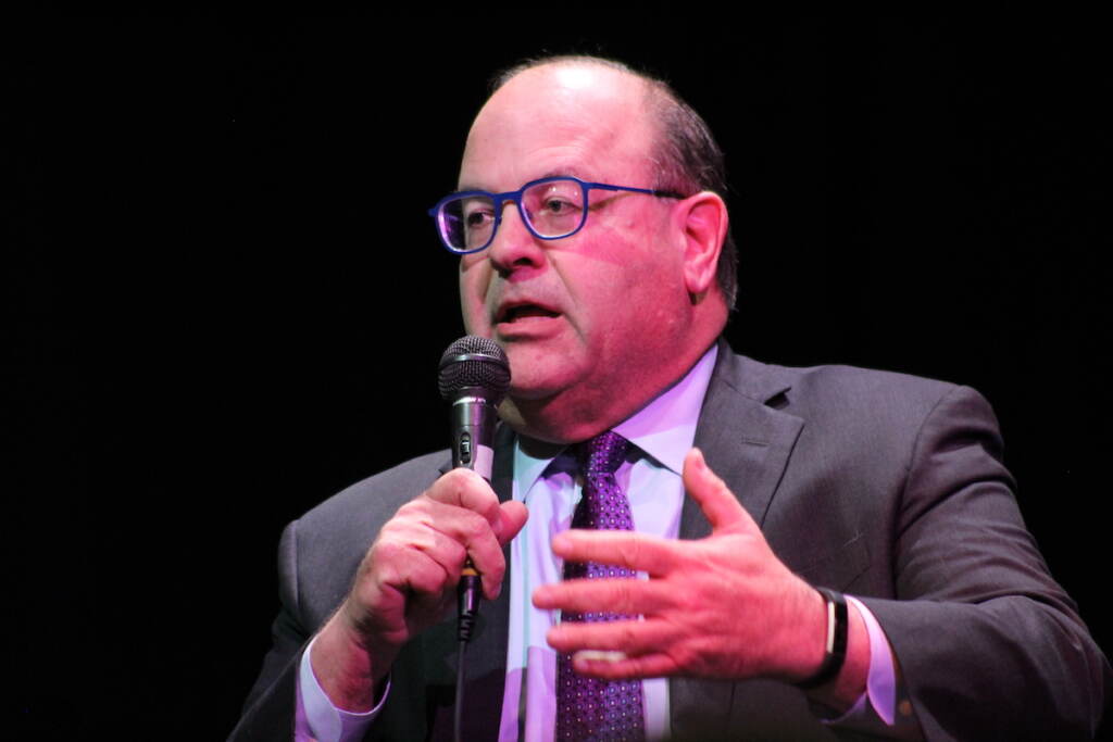 Councilmember Domb speaks into a microphone.