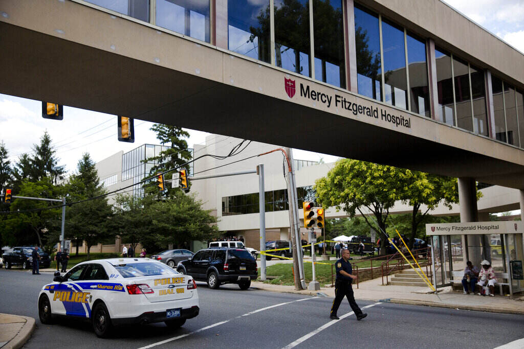 Hospital Shooting Provider Safety A walkway has a sign that reads Mercy Fitzgerald Hospital.