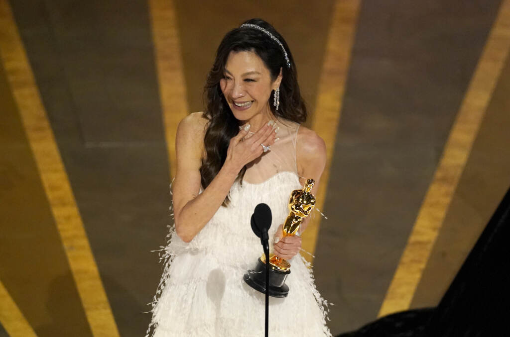 Michelle Yeoh accepts the award for best performance by an actress in a leading role for 