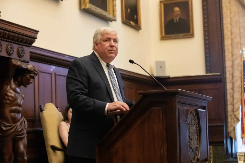 Mike Driscoll standing at a podium