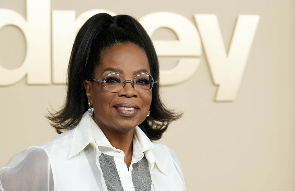 FILE - Oprah Winfrey, a producer of the documentary 'Sidney,' about actor Sidney Poitier, appears at the premiere on Sept. 21, 2022 in Los Angeles. Winfrey announced that she had chosen Ann Napolitano’s book 'Hello Beautiful' for her 100th book club pick. (AP Photo/Chris Pizzello, File)