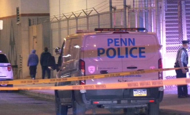 penn-police-hit-and-run Crime tape is visible in front of a van that has a sign that reads